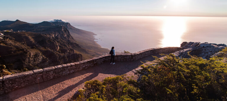 Journal Entry image with woman looking over wall on a pathway